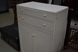 A vintage painted bedroom cabinet
