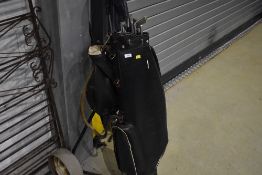 A set of golf clubs and bag