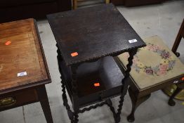 An early 20th Century oak occasional table or plant stand, square top approx. 36cm, the undertier