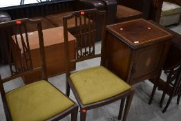An Edwardian mahogany and inlaid pot cupboard and pair of similar bedroom chairs