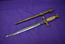 A German WW2 period Kriegsmarine Dagger with scabbard by Puma Solingen handle chipped two small