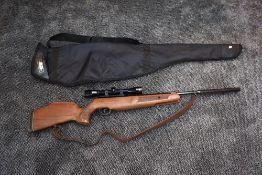 A Theoben .22 HE Air Rifle with silencer and one piece Nikko Stirling 4 x 32 scope, with soft