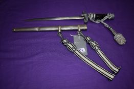 A German WW2 First Pattern Railway Leaders Dagger with straps, knot and scabbard, makers mark ROEt