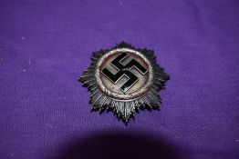 A German WW2 Cross in Silver, makers mark 20 on back of pin