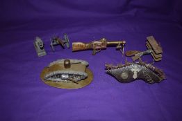 A collection of WW1 Trench Art including German Tri-Plane, Loius Machine Gun, British Tank, Shrapnel