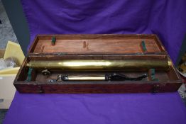 A vintage brass three drawer telescope by Reynolds & Branson of Leeds, with brass stand and in a