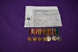 A group of WW2 miniature medals with photocopied Discharge Certificate to Arthur William James