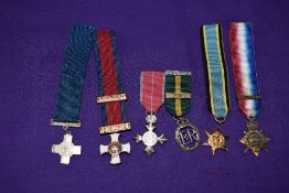 A Collection of Six Miniature Medals, 1914 Star Mons Clasp, George Cross, Distinguished Service