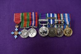 A group of three miniature medals, The Order of the British Empire Medal, Defence Medal and War