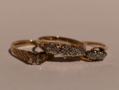 Three lady's dress rings of various forms, all having diamond chip decoration, two on 9ct gold loops