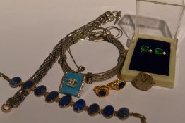 A small selection of white metal jewellery including Lapis lazuli set articulated bracelet, woven