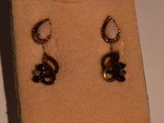 A pair of 9ct gold stud earrings having sapphire and diamond chip decoration and another pair of 9ct