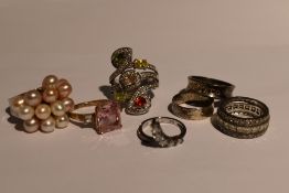 Seven assorted white metal dress and band rings stamped 925 including multi pearl, cubic zirconia,
