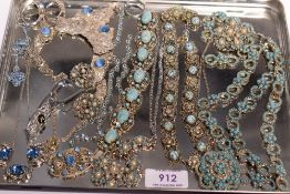 A selection of vintage blue costume jewellery including turquoise style bracelets, necklaces,