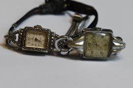 A lady's continental silver cocktail watch by Bucherer stamped 800 having a baton numeral face in