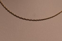 A yellow metal fine link rope chain stamped 9K, approx 18' & 1.1g