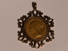 An 1860 gold shield sovereign in a removable 9ct gold decorative pendant mount, approx 13.4g