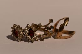 A lady's dress ring having alexandrite and diamond chips in a stylised mount, one stone missing,