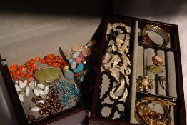 A Swedish jewellery box containing a selection of costume jewellery including wrist watches, fashion