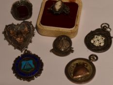 A small selection of HM silver and white metal including a cameo ring, marcasite ring and medalions