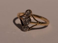 A lady's dress ring having a trio of diamonds, total approx 0.33ct in collared mounts on open triple