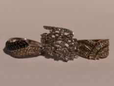 Three lady's silver and gold plate on silver dress rings having cubic zirconia decoration