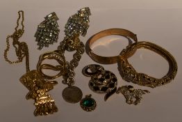 A selection of costume jewellery including rolled gold bangle Panther bangle, diamante chandelier