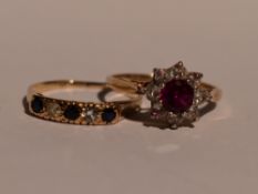 A lady's half eternity ring having three sapphires interspersed by cubic zirconia on a 9ct gold