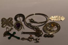 A selection of HM silver and white metal jewellery including Celtic thistle brooches, malachite