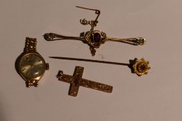 A small selection of 9ct gold and yellow metal stamped 9ct including cross pendant, bar brooch,
