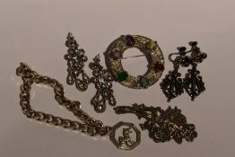 A small selection of white metal jewellery including a curb link bracelet and charm stamped 925/