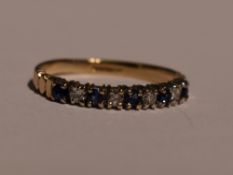 A lady's half eternity ring having five sapphires interspersed by diamond chips in a 9ct gold