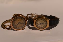 Two lady's vintage 9ct gold wrist watches having Arabic numeral dials with rolled gold and leather