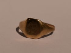 A 9ct gold signet ring of plain form, size M and 2.2g