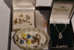 A cubic zirconia pendant in white metal mount stamped 925 on a silver chain with matched CZ