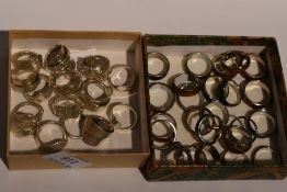 A selection of white metal and HM silver rings made from teaspoon stems, some bearing original