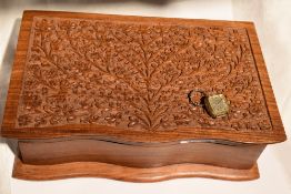 A modern treen jewellery box having extensively carved lid and containing a lady's 1970's Seiko Hi