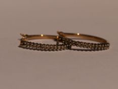 A pair of 9ct gold hoop earrings having cubic zirconia decoration, approx 2g