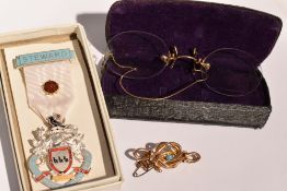 A yellow metal knot brooch having central turquoise, a pair of pincette glasses having rolled gold