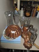 A selection of table wares including copper jelly molds and glass vase etc