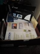 A selection of stationary including photographic paper and envelopes etc.