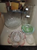 A selection of clear cut and colour glass wares including fruit bowls vase and tray