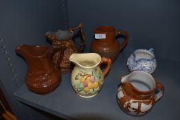 An assortment of six jugs including Shorter and son and earthen ware examples.