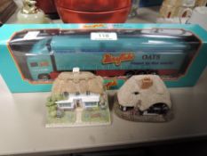 A die cast model truck for Mornflakes by Corgi and two Lilliput lane houses