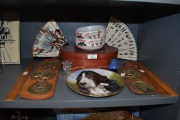 A variety of items including horse brasses, display plate, wooden rules and fans.