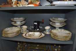A good quantity of French plates and cake stands having floral pattern and gilt detailing,two