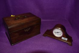 An antique mahogany veneered tea caddy having three internal compartments and a small Mahogany
