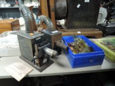 A German magic lantern slide projector and slide selection.