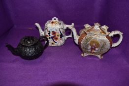 A Burleigh chinoiserie tea pot, a basalt tea pot with spaniel to lid and another having floral