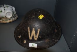 An air raid wardens tin hat.